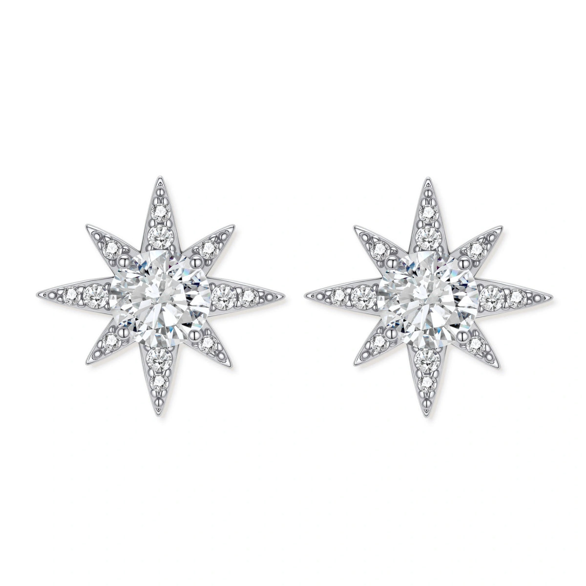 Sterling silver star-shaped stud earrings with brilliant moissanite center stones and pavé details on neutral background.