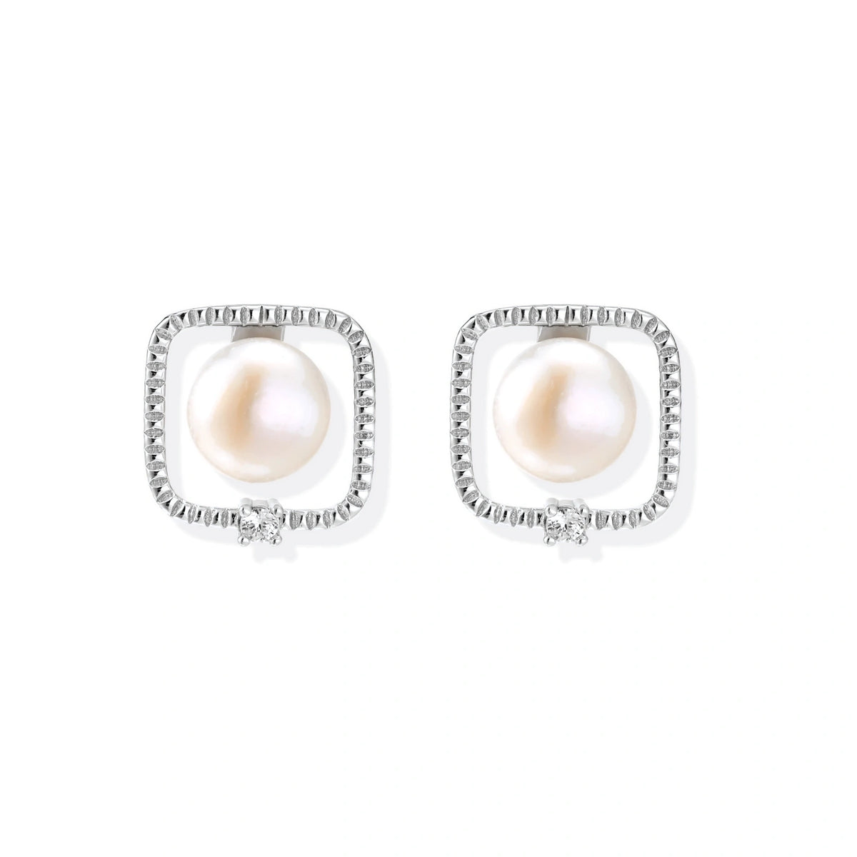 Rhodium-plated silver stud earrings with cushion frame, centered freshwater pearl, and tiny crystal accent